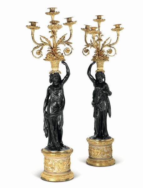 Coppia di imponenti candelabri a quattro luci in bronzo patinato e dorato. Dal modello di Francois Remond, Francia  - Asta Dimore Italiane - Associazione Nazionale - Case d'Asta italiane