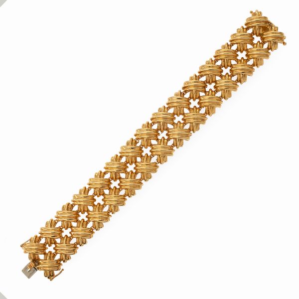 Bracciale a motivo di fiocchi in oro giallo 18kt  - Asta Gioielli Orologi | Fashion Vintage - Associazione Nazionale - Case d'Asta italiane