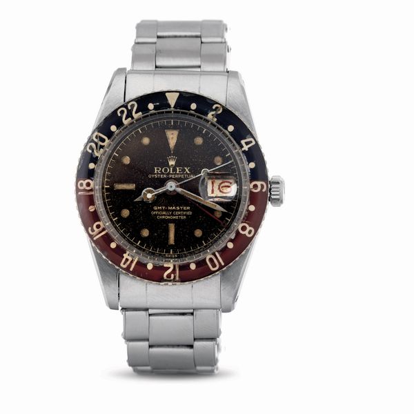 ROLEX : Estremamente raro e prezioso GMT Master ref 6542 Pepsi con ghiera in bachelite, quadrante virato tropical e datario roulette<BR>  - Asta Orologi da Polso - Associazione Nazionale - Case d'Asta italiane