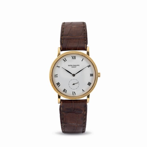 PATEK PHILIPPE : Fine ed elegante, Calatrava Clos de Paris da polso a carica manuale in oro giallo 18 kt, referenza 3919, corredato da scatola e garanzia  - Asta Orologi da Polso - Associazione Nazionale - Case d'Asta italiane