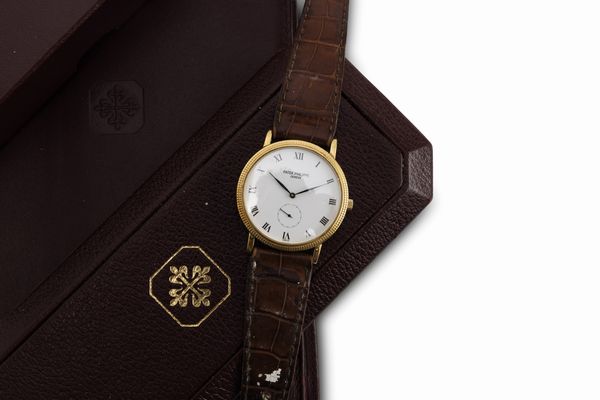 PATEK PHILIPPE : Fine ed elegante, Calatrava Clos de Paris da polso a carica manuale in oro giallo 18 kt, referenza 3919, corredato da scatola e garanzia  - Asta Orologi da Polso - Associazione Nazionale - Case d'Asta italiane