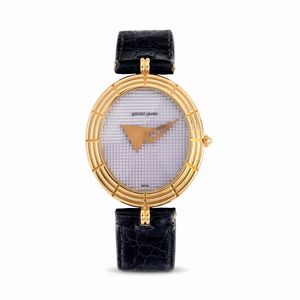 GERALD GENTA - Elegante orologio da polso di forma ovale, in oro giallo 18k, quadrante color malva accompagnato da garanzia originale