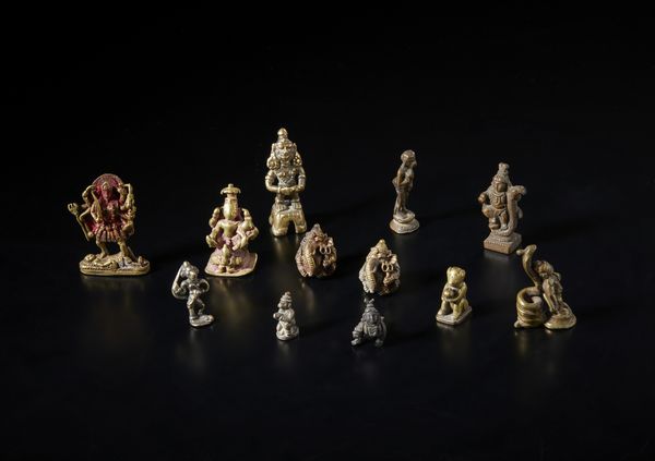 Arte Indiana : Gruppo di dodici bronzi in miniatura raffiguranti divinit varie. India, XIX secolo.  - Asta Asta 437 | ARTE ORIENTALE - ARTE ORIENTALE DA COLLEZIONI PRIVATE ITALIANE Online - Associazione Nazionale - Case d'Asta italiane