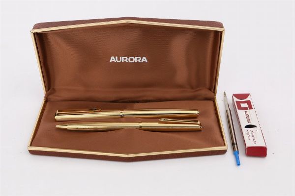 Aurora, penna stilografica e penna a sfera in metallo dorato  - Asta Penne e Accessori da Scrivania - Associazione Nazionale - Case d'Asta italiane