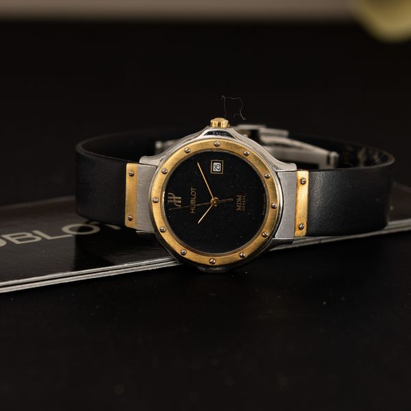 HUBLOT : MDM Lady acciaio e oro al quarzo, quadrante nero con datario, cinturino in gomma con garanzia, 25,5 mm  - Asta Watches - Associazione Nazionale - Case d'Asta italiane