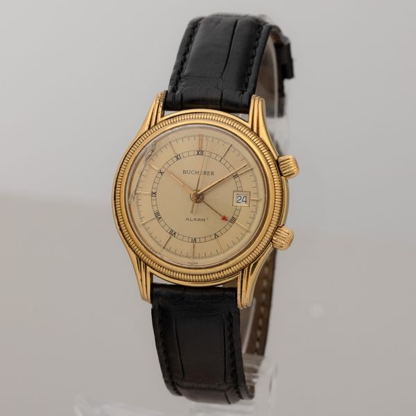 BUCHERER : Svegliarino Alarm laminato automatico con datario, quadrante champagne bitonale, 37 mm  - Asta Watches - Associazione Nazionale - Case d'Asta italiane