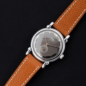 ORIS : Raro orologio carica manuale, anse Fancy in acciaio con quadrante grigio bitonale e numeri Romani 33 mm  - Asta Watches - Associazione Nazionale - Case d'Asta italiane