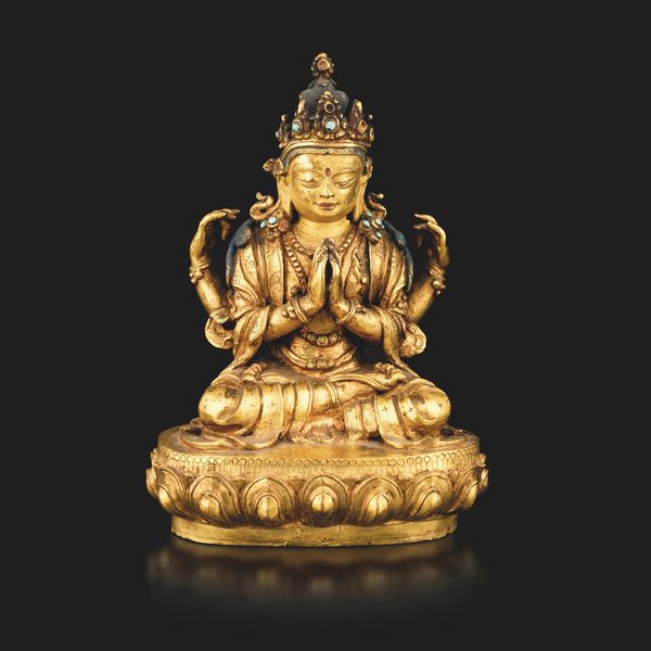 Figura di SHADAKSHARA AVALOKITESVARA seduto su fior di loto in bronzo dorato, tracce di policromia e innesti in turchese, Mongolia, XVII - XVIII<BR>  - Asta Fine Asian Works of Art - Associazione Nazionale - Case d'Asta italiane