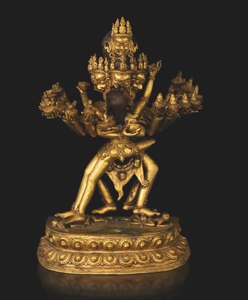 Figura di Guhyasamaja in Yab-Yum stante su doppio fiore di loto in bronzo dorato con tracce di policromia, Tibet, XIX secolo  - Asta Fine Asian Works of Art - Associazione Nazionale - Case d'Asta italiane