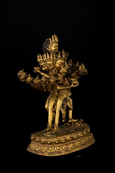 Figura di Guhyasamaja in Yab-Yum stante su doppio fiore di loto in bronzo dorato con tracce di policromia, Tibet, XIX secolo  - Asta Fine Asian Works of Art - Associazione Nazionale - Case d'Asta italiane