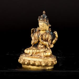 Figura di SHADAKSHARA AVALOKITESVARA seduto su fior di loto in bronzo dorato, tracce di policromia e innesti in turchese, Mongolia, XVII - XVIII<BR>  - Asta Fine Asian Works of Art - Associazione Nazionale - Case d'Asta italiane