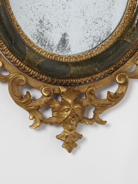 MANIFATTURA VENEZIANA DEL XVIII SECOLO : Quattro specchiere in legno parzialmente dorato e laccato a finto marmo verde, decorazioni esterne in legno intagliato e dorato a motivi fitomorfi e a volute, maschera grottesca a supporto della parte inferiore  - Asta Asta 460 | ARTE ANTICA E DEL XIX SECOLO - Da una dimora veneta e altre committenze Tradizionale - Associazione Nazionale - Case d'Asta italiane