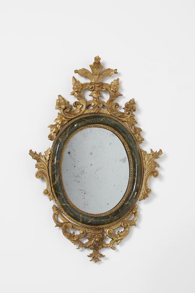 MANIFATTURA VENEZIANA DEL XVIII SECOLO : Quattro specchiere in legno parzialmente dorato e laccato a finto marmo verde, decorazioni esterne in legno intagliato e dorato a motivi fitomorfi e a volute, maschera grottesca a supporto della parte inferiore  - Asta Asta 460 | ARTE ANTICA E DEL XIX SECOLO - Da una dimora veneta e altre committenze Tradizionale - Associazione Nazionale - Case d'Asta italiane