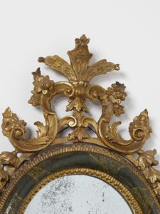 MANIFATTURA VENEZIANA DEL XVIII SECOLO : Quattro specchiere in legno parzialmente dorato e laccato a finto marmo verde, decorazioni esterne in legno intagliato e dorato a motivi fitomorfi e a volute, maschera grottesca a supporto della parte inferiore  - Asta Asta 460 | ARTE ANTICA E DEL XIX SECOLO - Da una dimora veneta e altre committenze Tradizionale - Associazione Nazionale - Case d'Asta italiane