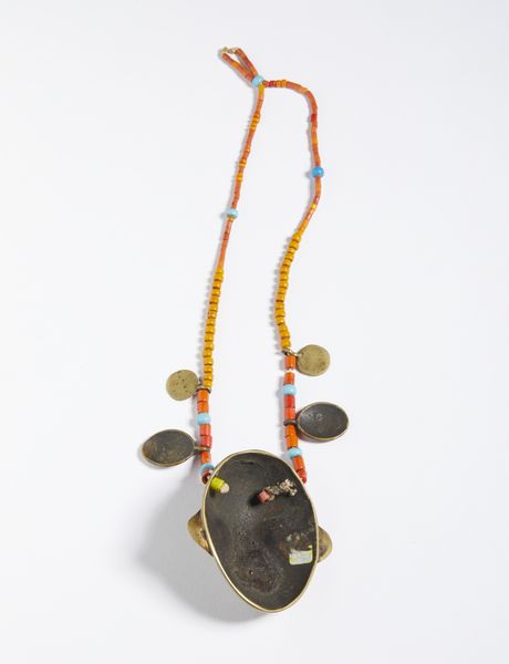 Collana con pendente Naga e testine. Ottone e perline.India Assam, XX sec.  - Asta Asta 464 | WUNDERKAMMER, CURIOSITIES & ETNOGRAFICA - GENIUS & ART Online - Associazione Nazionale - Case d'Asta italiane