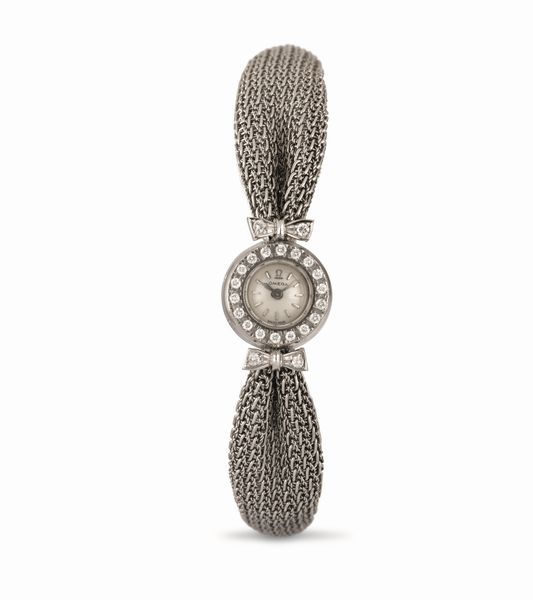 OMEGA : Lady a forma di Fiocco in oro bianco con diamanti sulla ghiera accompagnato da scatola originale  - Asta Orologi da Polso - Associazione Nazionale - Case d'Asta italiane