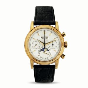 PATEK PHILIPPE - Ref 2499/100, importante e raro orologio da polso con calendario perpetuo in oro giallo con fasi lunari