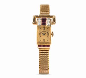 Universal Genève - Orologio da Cocktail in oro giallo con diamanti e rubini incastonati, ansa superiore snodata, carica manuale