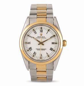 ROLEX - Rolex Classico Oyster Perpetual ref 14203 in acciaio e oro, ghiera liscia quadrante bianco con numeri Romani, bracciale Oyster