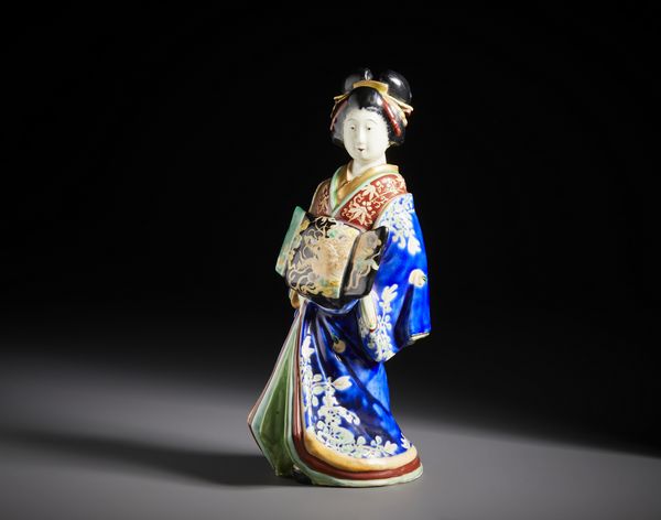 ARTE GIAPPONESE : Due figure in porcellana raffiguranti un dignitario e una geisha ben modellate, riccamente decorati con smalti policromi e dorature.Giappone periodo Meiji.  - Asta Asta 470 | ARTE ORIENTALE Online - Associazione Nazionale - Case d'Asta italiane