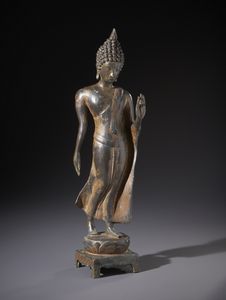 Arte Sud-Est Asiatico - Figura in bronzo raffigurante il famoso walking Buddha nello stile Sukothay. Tailandia XX sec