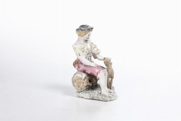 Figurina di giovane con cane. <BR>Liguria, XX secolo.  - Asta Ceramiche e vetri - Associazione Nazionale - Case d'Asta italiane