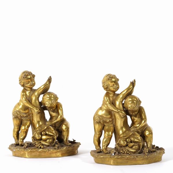 Coppia di putti allegoria dellAbbondanza, XX secolo.<BR>  - Asta Ceramiche e vetri - Associazione Nazionale - Case d'Asta italiane