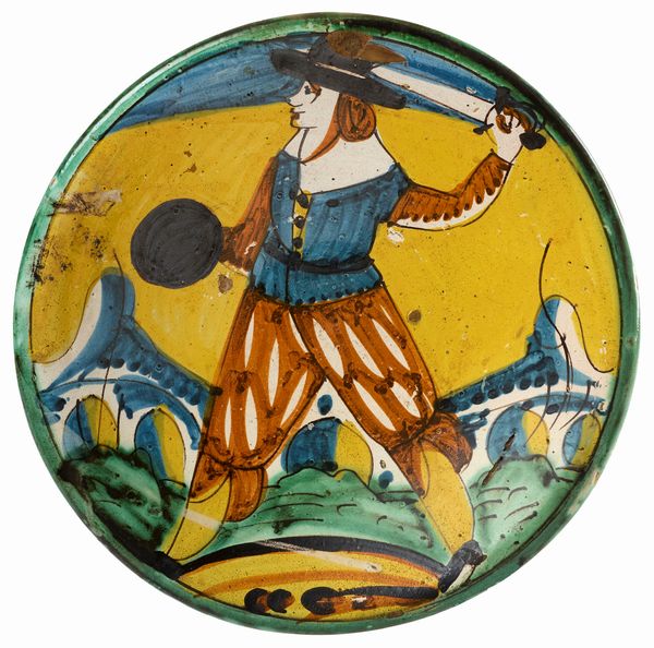 Piatto in maiolica policroma giallo, ocra, verde e manganese  - Asta Maioliche, Sculture e Dipinti Antichi - Associazione Nazionale - Case d'Asta italiane