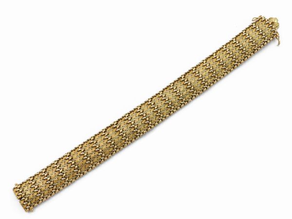 Bracciale intercciato Micheletto in oro giallo e bianco  - Asta Gioielli e Orologi - Associazione Nazionale - Case d'Asta italiane