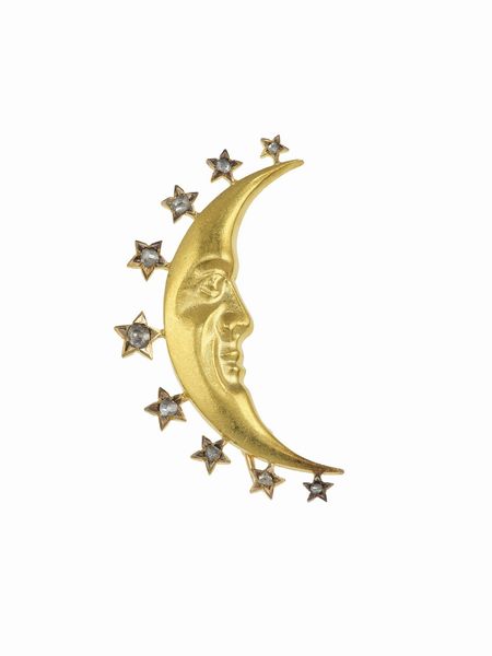 Lotto composto da due bracciali con charms ed una spilla Mezza luna  - Asta Fine Jewels - Associazione Nazionale - Case d'Asta italiane