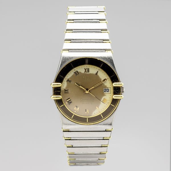 OMEGA : Omega Constellation in acciaio con inserti in oro, quadrante champagne, datario e numeri arabi, ref 1503.10.00, movimento automatico, bracciale in acciaio, 31 mm  - Asta Orologi da Polso - Associazione Nazionale - Case d'Asta italiane