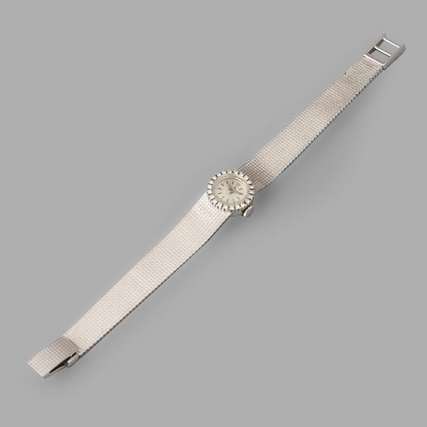 Baume & Mercier : Baume & Mercier Lady in oro bianco 18k, quadrante Argent, brillanti, indici applicati, bracciale integrato, carica manuale, 15,5 mm  - Asta Orologi da Polso - Associazione Nazionale - Case d'Asta italiane