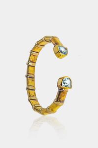 BRACCIALE - Peso gr 40 5 rigido in oro giallo e argento 925/1000 (nelle fasce di decorazione); terminali con due topazi taglio  [..]