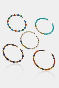 LOTTO DI CINQUE BRACCIALI - Peso complessivo gr 26 5 rigidi  con perle  pietre dure di varie forme e misure  perle di acqua dolce  pasta di  [..]