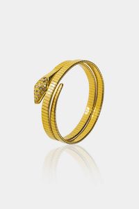 BRACCIALE - Peso gr 48 5 rigido  in oro giallo  a forma di serpente con testa in diamanti taglio 8/8 per totali ct 0 40 ca