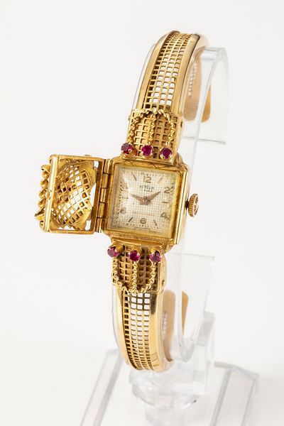 Astrolux bracciale con orologio a scomparsa in oro giallo, anni 1940-50  - Asta Gioielli - Associazione Nazionale - Case d'Asta italiane