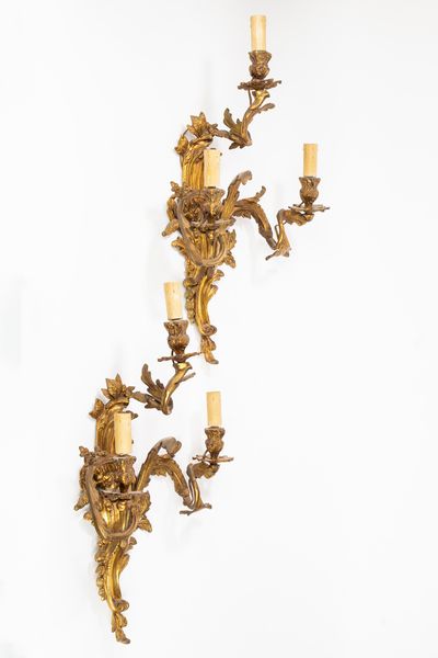 Coppia di applique in bronzo dorato a tre luci  - Asta Incanti d'Arte - Associazione Nazionale - Case d'Asta italiane