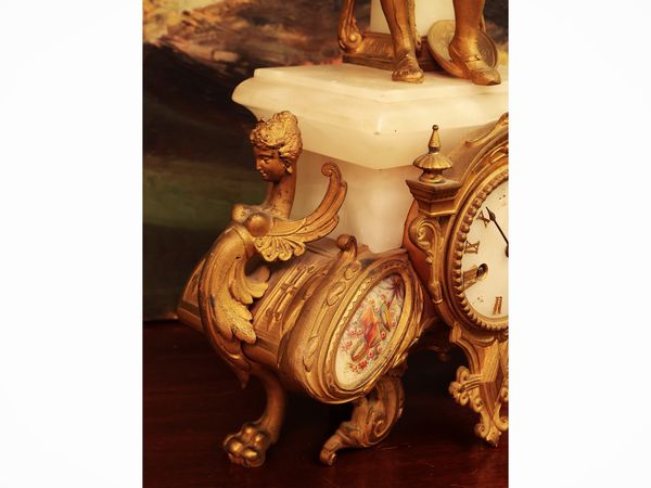 Orologio da tavolo in metallo dorato e onice  - Asta Due case fiorentine - Associazione Nazionale - Case d'Asta italiane