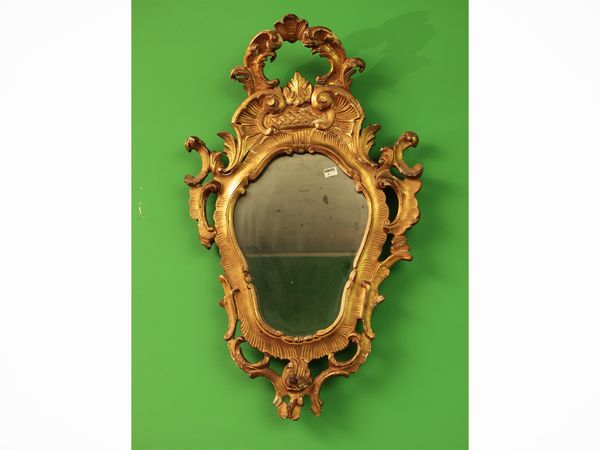 Specchiera a ventola in legno intagliato e dorato  - Asta Due case fiorentine - Associazione Nazionale - Case d'Asta italiane