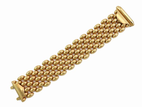 Bracciale a fascia carro armato in oro giallo  - Asta I gioielli di Rosa Segreto Annigoni - Associazione Nazionale - Case d'Asta italiane
