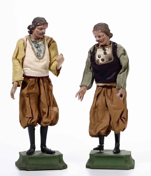 Due statuine da presepe raffiguranti uomini con baffi e pantaloni marroni. Genova XIX secolo  - Asta Presepe | Cambi Time - Associazione Nazionale - Case d'Asta italiane