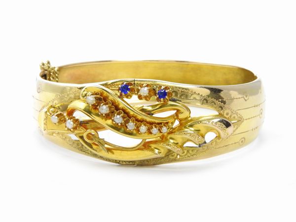 Bracciale rigido in oro giallo a basso titolo con microperle  - Asta Gioielli d'epoca e Orologi - Associazione Nazionale - Case d'Asta italiane