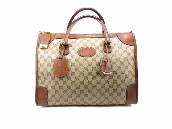 Borsa in tela monogram e pelle di cinghiale marrone, Gucci  - Asta Fashion Vintage e Bijoux / Un guardaroba maschile - Associazione Nazionale - Case d'Asta italiane