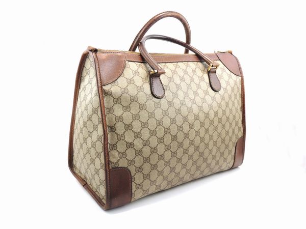 Borsa in tela monogram e pelle di cinghiale marrone, Gucci  - Asta Fashion Vintage e Bijoux / Un guardaroba maschile - Associazione Nazionale - Case d'Asta italiane